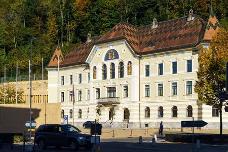 Vaduz, Liechtenstein - October 19, 2017: Government Building at autumn with coat if arms on facade
