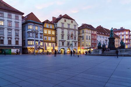 Graz, Austria - October 23, 2017: Houses on Hauptplatz panorama and Erzherzog Johann Brunnen (1893) at nightのeditorial素材