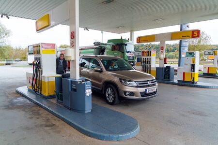 Graz, Austria - October 23, 2017: Refueling Shell with cars that came for gasoline