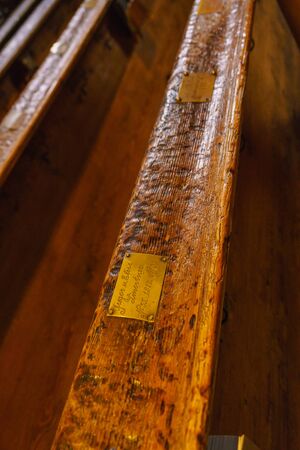 St.Wolfgang, Austria - October 24, 2017: Ancient benches in the interior of the Catholic cathedral...