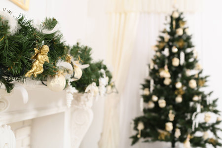 christmas decorated room with a defocused tree and a mantelpieceの写真素材