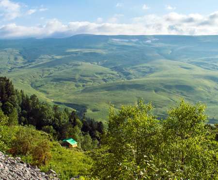 Tourist tent in camp among meadow in the mountain in nasty dayの写真素材