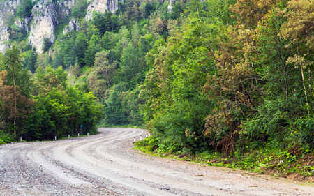 Mud road in mountain turn left and rightの写真素材