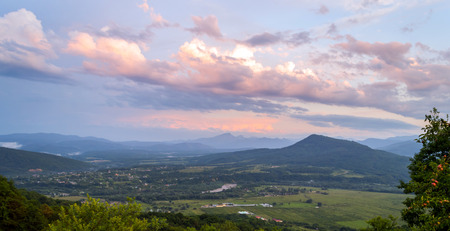 Sunset in the mountains. Pink clouds in the skyの写真素材