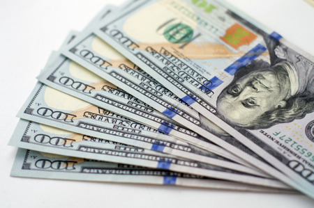 Close up view of pile of US dollarsの写真素材
