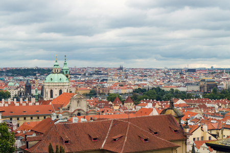 Cloudy nasty day in Prague. Red roofs in the city Prague. Panoramic view of town, Czech Republic, Europeの写真素材
