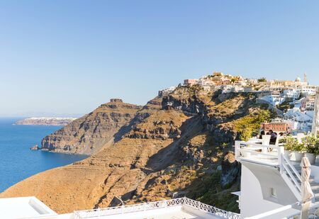 View of the seacoast and white Oia town on mountain. Santorini island, Greece. Beautiful summer landscapeの写真素材