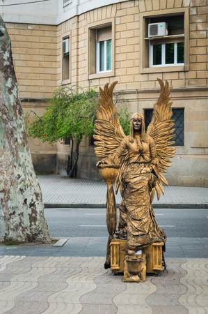 Barcelona, Spain - June 24, 2013: Street performer, live statue at La Ramblas street.のeditorial素材