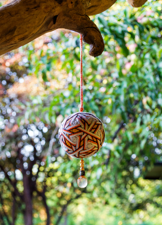 Wooden natural interior decorative amulet ball in gardenの写真素材