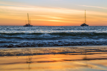 Sailing boats on the sea at sunset. Bang Tao beach, Phuket, Thailandの写真素材