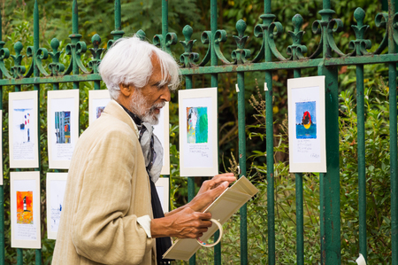 The French artist exposes his paintings on the street. Paris, France, October 04, 2014.のeditorial素材