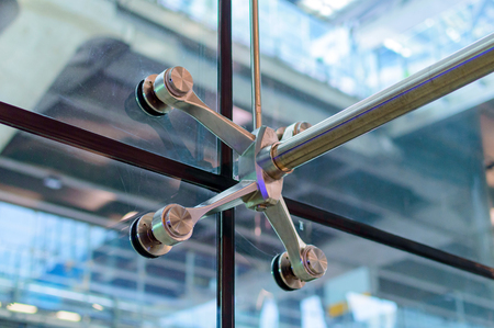 Metal mount with fasteners elements of spider glass system for glass wallsの写真素材