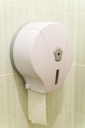 Toilet paper box dispenser on the wall in restroomの写真素材