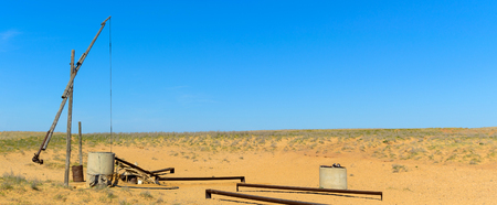 Old sweep well and shadoof in steppe.の写真素材
