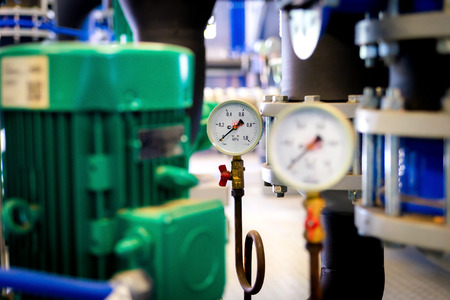 System of hot water pipes with manometer in boiler room.の写真素材