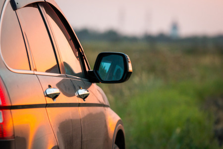 Angle shot of a car against sunset in the background.の写真素材