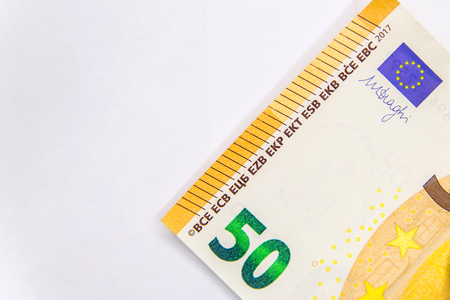 Fifty Euro banknote fragment closeup on white backgroundの写真素材