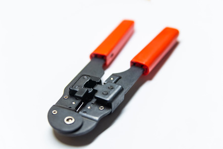 Modular crimping tool isolated on white background.