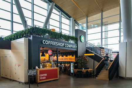 Rostov-on-Don, Russia - September 11, 2018: Tourists in International airport Platov waiting for flight in cozy cafe. Interior of building.のeditorial素材