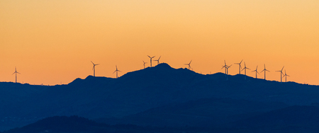 Wind Turbines High Hill Green Energy Generate Power Sunset.の写真素材