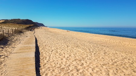 Wooden path on sand to sea. Vacation and rest on a beach concept.の写真素材