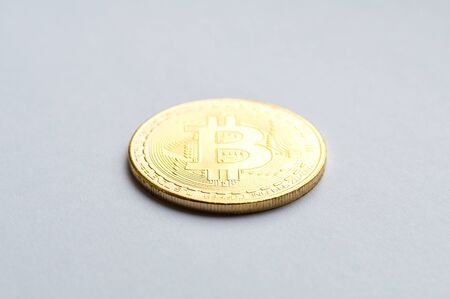 Golden bitcoin on white background. Concept mining. Copyspaceの写真素材