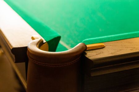 Pit of corner table snooker. Hole on billiard table.