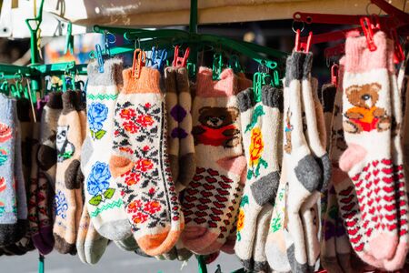 Traditional knitted socks as rural souvenirs on street market.の写真素材