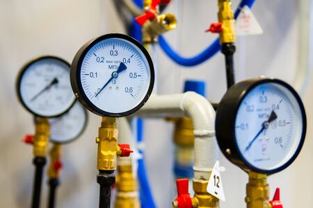 Industrial equipment with pressure gauge meters. Selective focus.