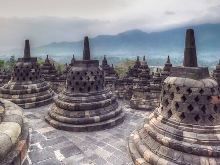 Sunrise background at Borobudur Temple in Indonesiaの写真素材