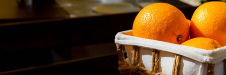 Orange as organic ripe fruit in basket on open air.の写真素材