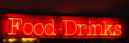 Red neon sign title Food and Drinks.の写真素材
