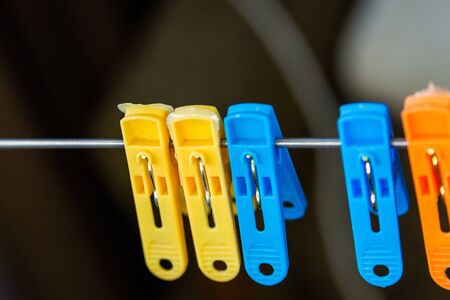 Close-up of colorful laundry pins and for hanged clothes drying.の写真素材
