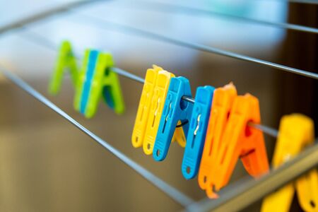Close-up of colorful laundry pins and for hanged clothes drying.の写真素材