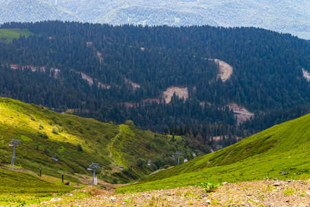 Chairlift in a mountain region in summer. Life of ski resort in summertime.