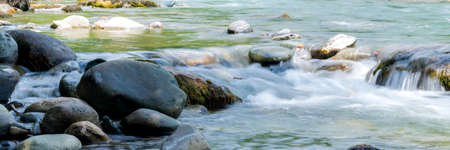 Rocky stream running water. Mountain river flow