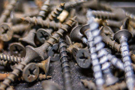 Macro photo of screws. Set of screws. Construction abstraction. Industrial background. Screws macro...