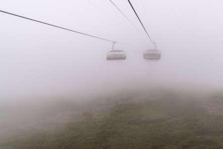 Chairlift in a mountain region in summer. Life of ski resort in summertime.