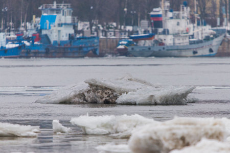 Drifting iceberg floes float on the water. Breaking of the ice on the river in the spring.の写真素材