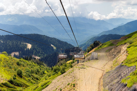 Chairlift in a mountain region in summer. Life of ski resort in summertime.の写真素材