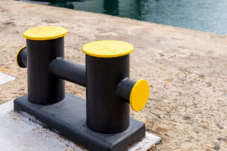 Mooring bollard on a wharf, to which a ship's rope may be secured.