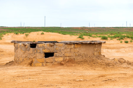Old big water well in the steppe.の写真素材