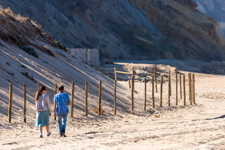 Portugal, Praia Santa Rita Norte, October 04, 2018: Wooden path on a sand beach for walking.のeditorial素材