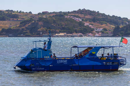 Lisbon, Portugal, October 08, 2018: Passenger amphibia or sightseeing tour bus sailing on Tagus river. Trip on a blue Lisboat MH 1 Marujo vehicle boat.のeditorial素材