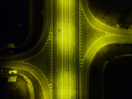 Aerial night view of suburban empty roads with street lights during lockdown.の写真素材