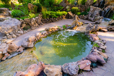 Landscape design. Artificial waterfall in a garden.の写真素材