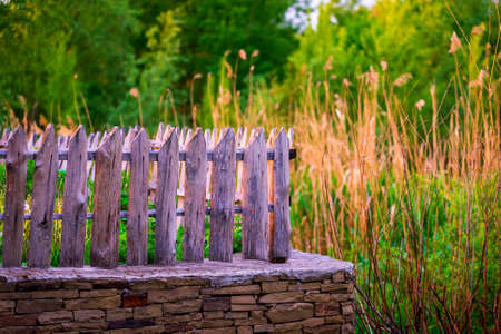 Fragment of beautiful fence made of wood in a small village.の写真素材