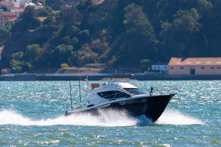 Powerboat speed cruising in the sea or river.