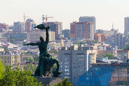 Russia, Rostov on Don, June 27, 2020: The monument of the strike of 1902, two men on a concrete pedestal in Rostov-on-Don on a hill. City background.のeditorial素材