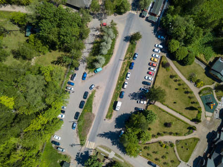 air top view. Open-air car parking lot near a park or forest.の写真素材